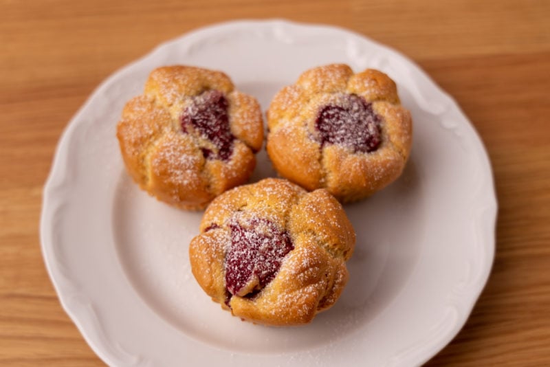 Raspberry muffins sprinkled with powdered sugar