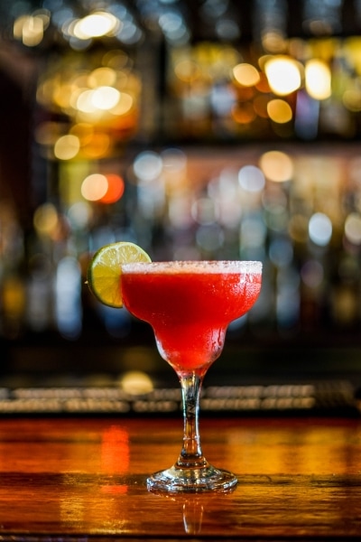 Red margarita on a bar table