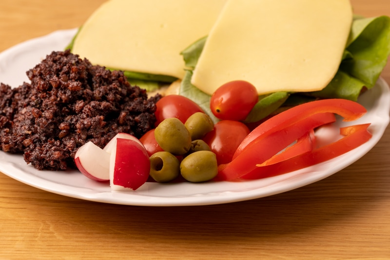 Sandwiches, olives, and veggies