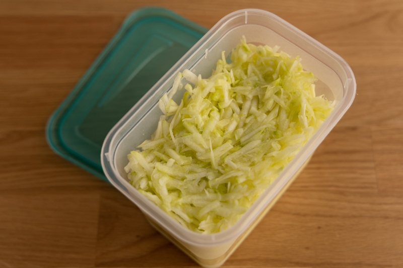 Schredded zucchini in a container