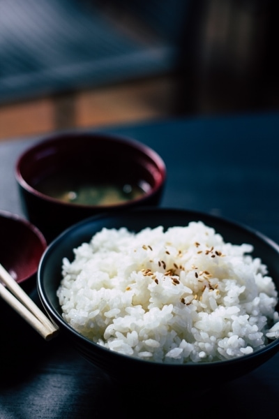 Sesame rice in a black bowl