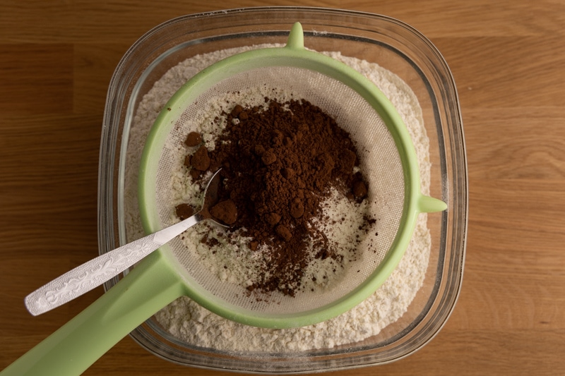 Sifting cocoa powder and flour