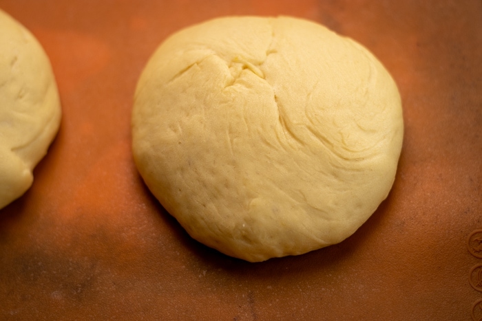 Single hamburger bun before baking