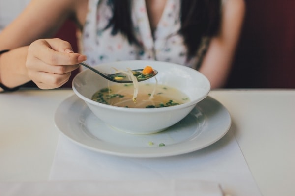 Soup with noodles in a ceramic bowl