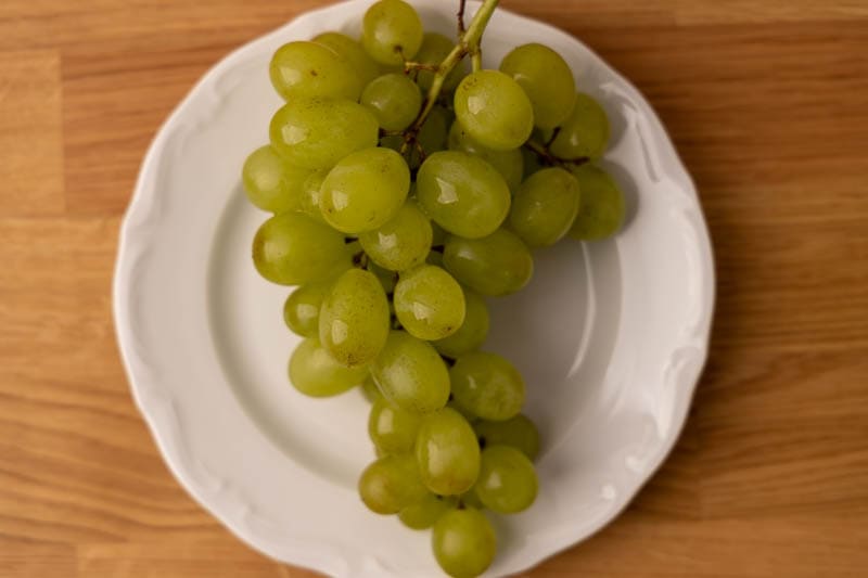 Sprig of grapes on a plate