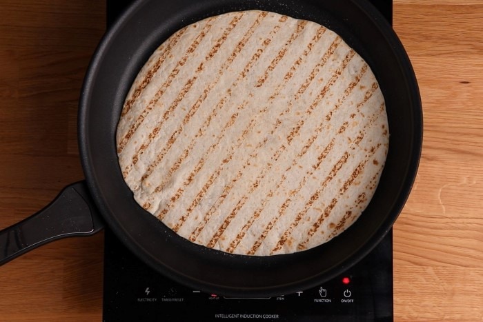 Thawing and reheating a tortilla on the stove