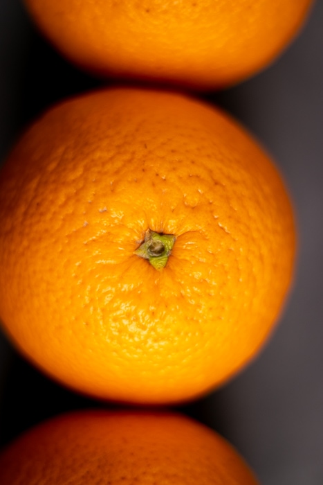 Three oranges side by side