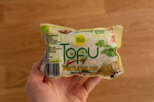 Tofu package in hand
