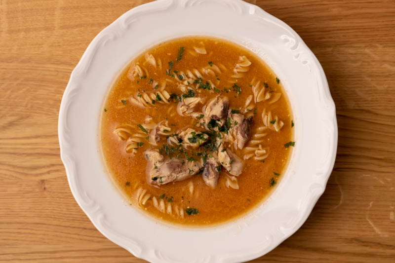 Tomato soup with macaroni and cooked chicken