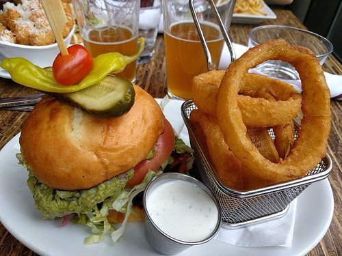 Torta burger with onion rings and ranch dressing