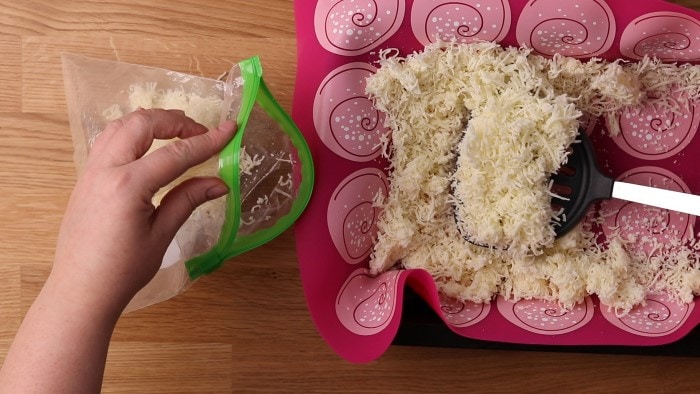 Transferring frozen mozzarella into a bag