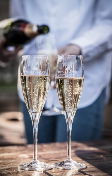 Two champagne glasses on a table