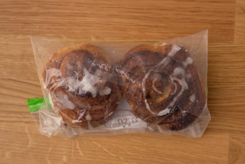 Two cinnamon rolls in a freezer bag