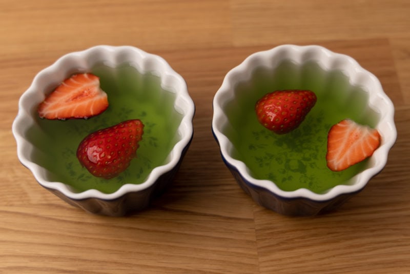 Two jello desserts with strawberries