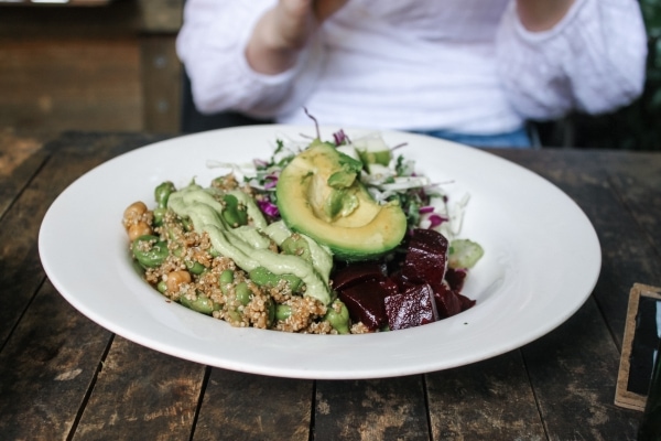 Vegan bowl with quinoa, avocado, and beets