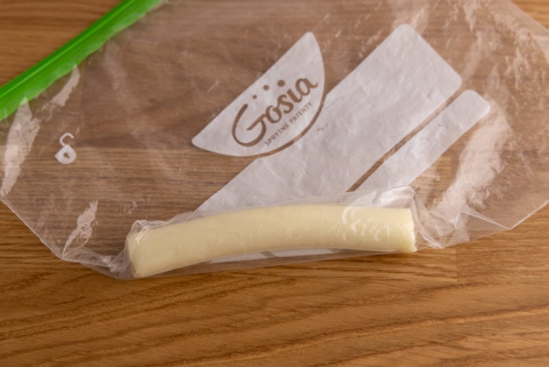 Wrapping cheese stick in a freezer bag
