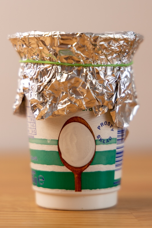 Yogurt container sealed with aluminum foil